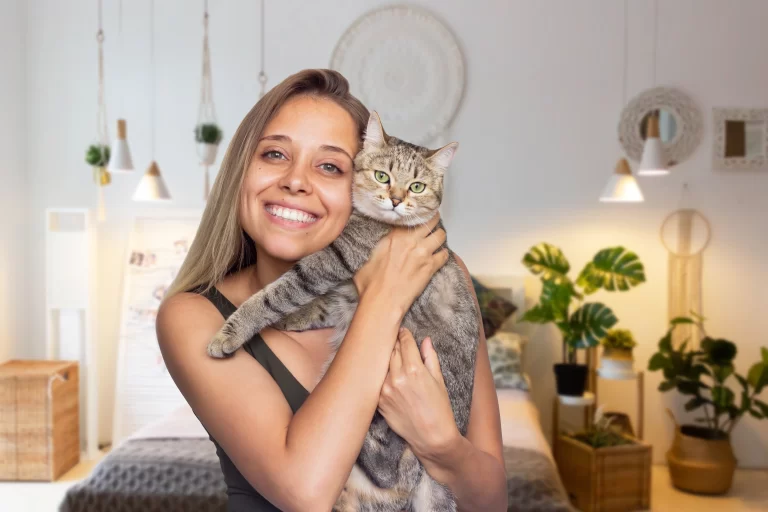 Owner holding her cat as she represent how owner's personality shapes their cats.